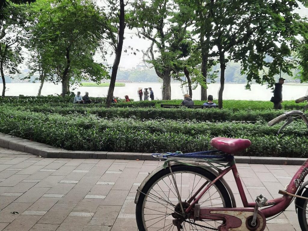 Image of a bicycle parked by the river in Hanoi. Taken by Danura Miriyagalla during a recent trip to Vietnam on 14 November 2023