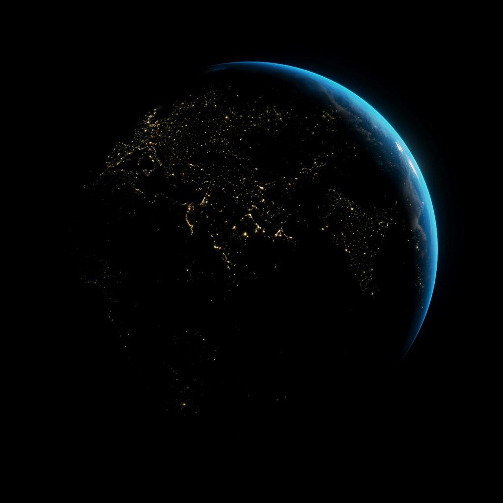 The World from space, areas are lit up by lights on a night time backdrop